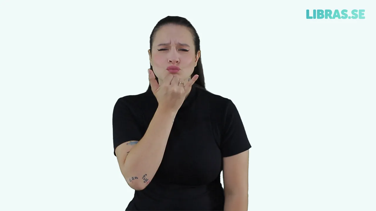 Intérprete fazendo o sinal de Desculpa em Libras