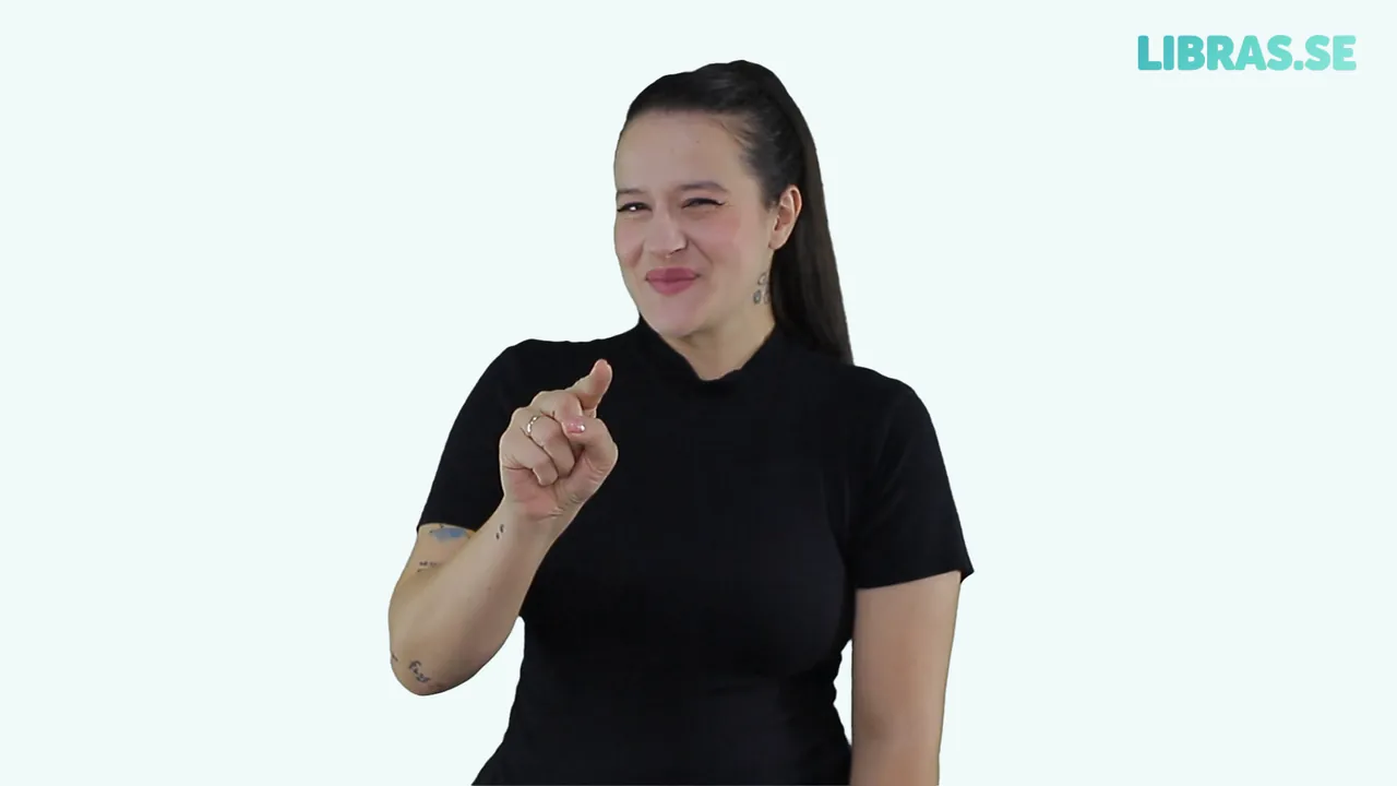 Intérprete fazendo o sinal de Eu te amo em Libras