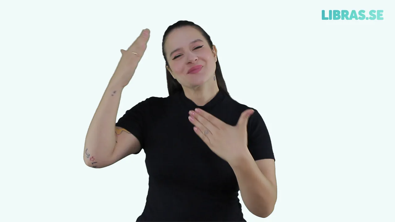 Intérprete fazendo o sinal de Obrigado em Libras